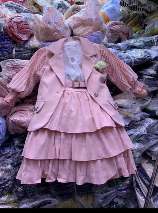 Pink skirt with top and jacket set.